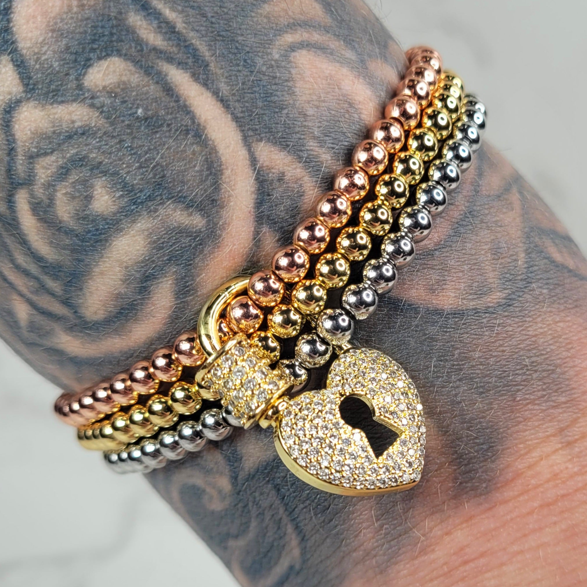 Pulsera con candado de corazón apilado